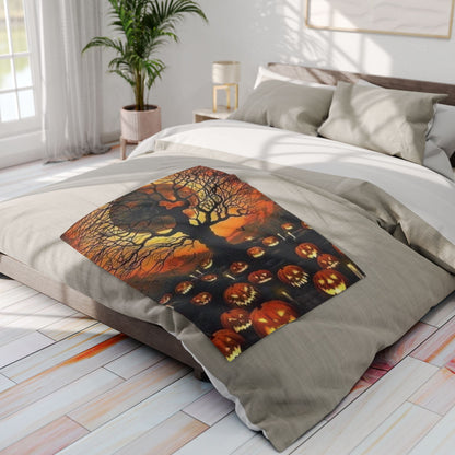 Luxurious Halloween-themed Arctic Fleece Blanket beautifully spread across a bed with pale linens, featuring intricate pumpkin and tree designs, ideal for creating a festive atmosphere.