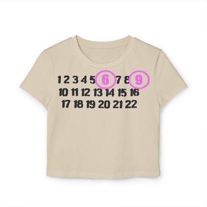 Luxurious cream cropped t-shirt showcasing a playful sequence of numbers 1 to 22, with bold 6 and 9 accented in light purple circles, made from soft organic cotton.
