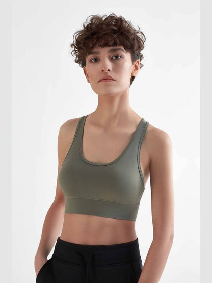 Chic and functional women's sports bra crafted from recycled materials, combining performance with luxury for the environmentally mindful consumer.