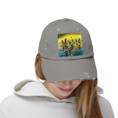Unisex Distressed Paddleboarders Cap featuring a vibrant fantasy scene of paddleboarders, designed for beach and river adventures, worn by a model.