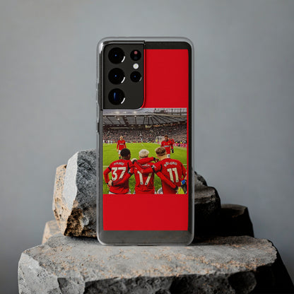 Stylish display of the Manchester United Mainoo Garnach Hojlund Soft Phone Case on a rocky surface, highlighting its vibrant design.