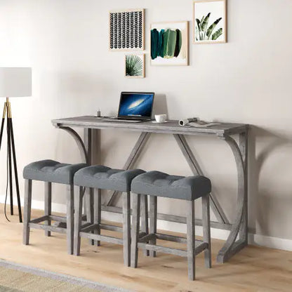 Elegant Apex Artisan Bar and workstation set against a neutral wall, showcasing a solid wood table with integrated power outlets and three chic light grey upholstered stools, ideal for modern living.