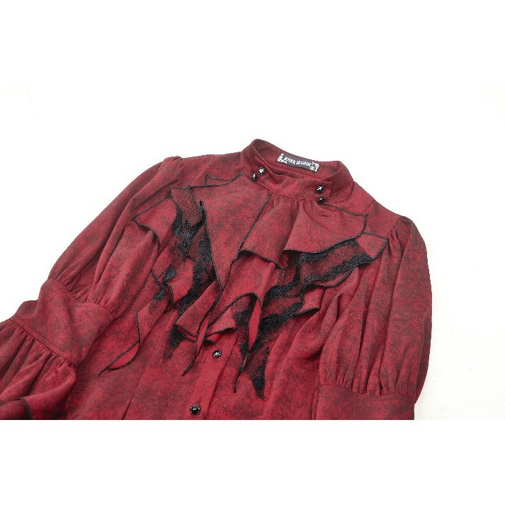 Side view of the Vampiretta Blouse highlighting its distressed fabric and elegant lace accessories.