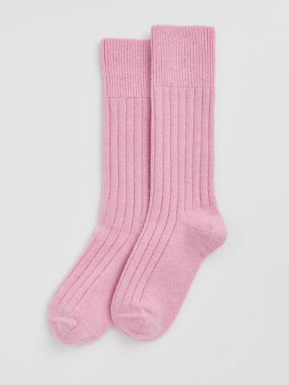 Elegant display of luxury Merino bed socks, designed for superior comfort and crafted in Portugal.