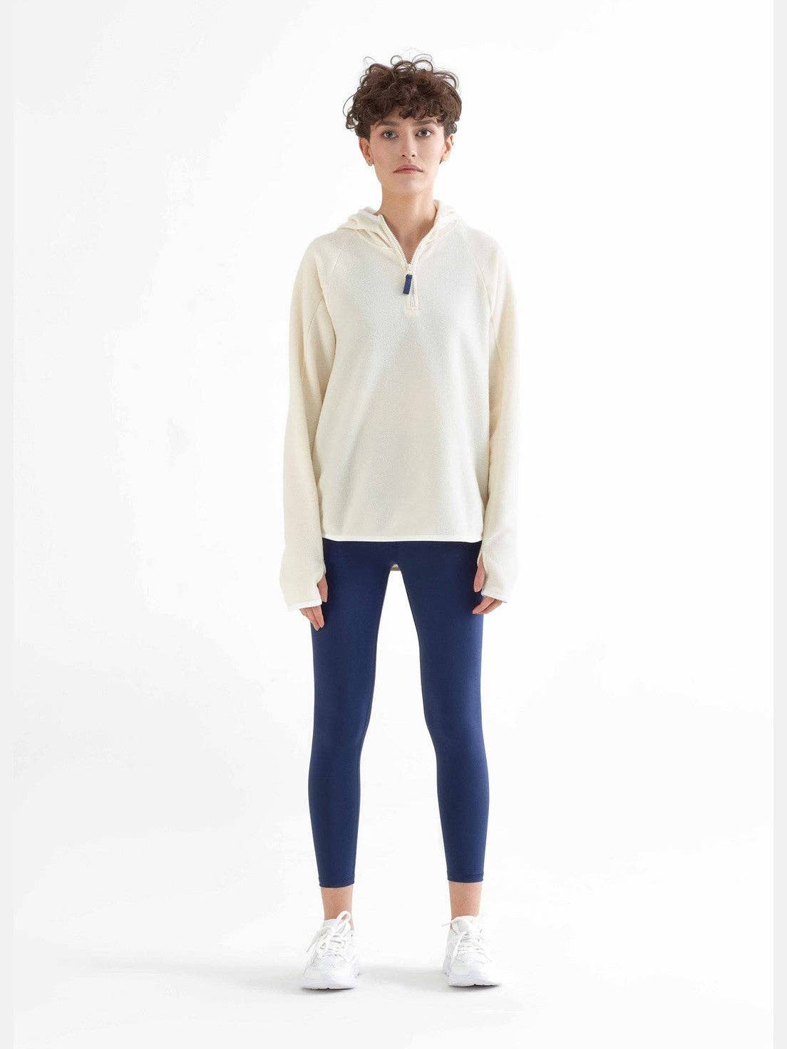 Close-up view of luxurious soft and firm stretch fabric of organic 7/8 leggings, highlighting the premium quality and flexibility.