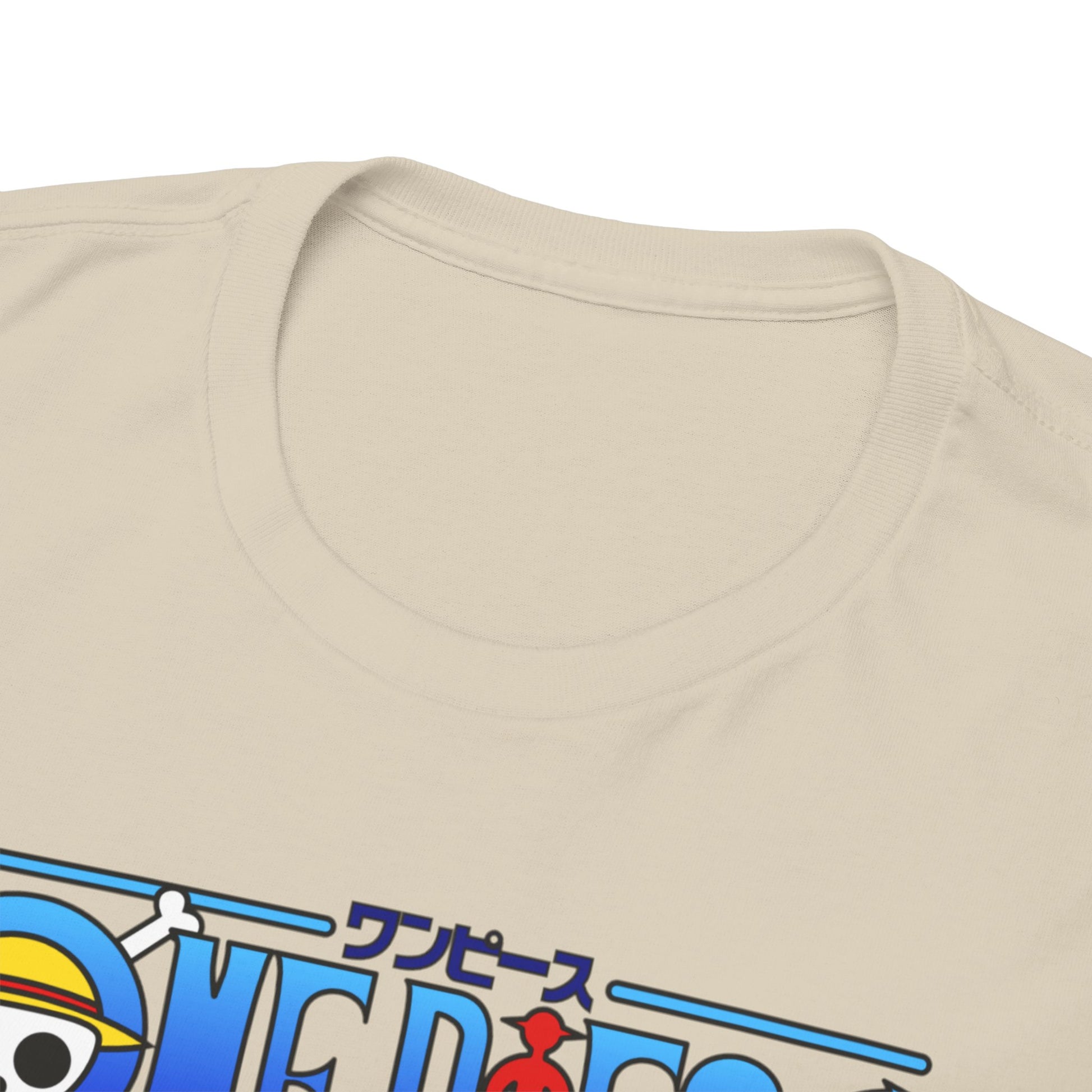 Close-up of luxurious beige T-shirt collar showcasing soft fabric and premium quality craftsmanship, featuring One Piece branding in bright colours.