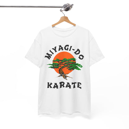 Chic hanging Miyagi-Do Karate t-shirt on a wooden hanger, illustrating a captivating bonsai tree design, symbolising strength and elegance in martial arts.