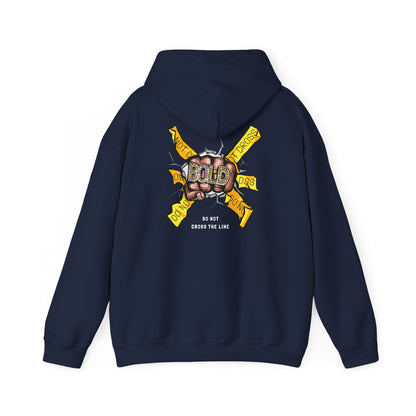 Luxurious navy hoodie featuring a striking back print with a bold clenched fist graphic and yellow warning banners stating 'DO NOT CROSS THE LINE', symbolizing individuality and empowerment.