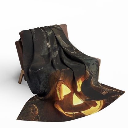 Elegant Halloween Arctic fleece blanket cascading over a modern armchair, embellished with mystical pumpkin imagery, ideal for enhancing autumn aesthetics in a sophisticated home.