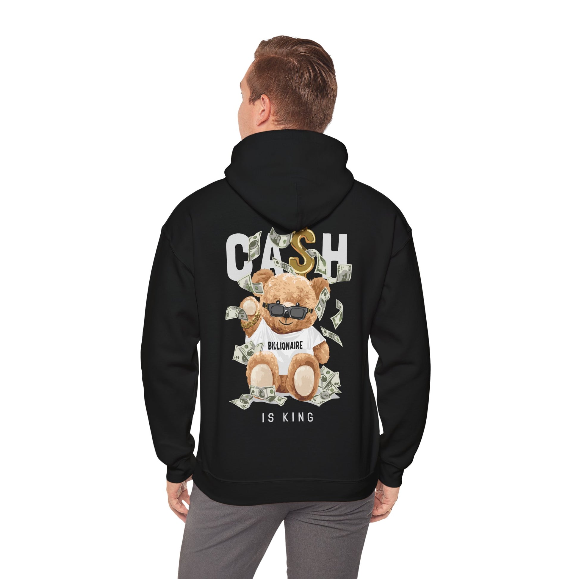 Black hoodie featuring a playful teddy bear graphic, stylishly adorned with dollar bills and a bold ‘BILLIONAIRE’ slogan, radiating unique charm.