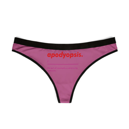 Sleek women's thong displayed flat, showcasing a whimsical pink design with the term 'apodyopsis' printed in bold red, ideal for adding a touch of humour to intimate apparel.