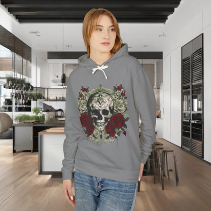 A model wearing a unisex lightweight hooded sweatshirt in grey with a striking skull and roses design, set in a luxurious kitchen backdrop.