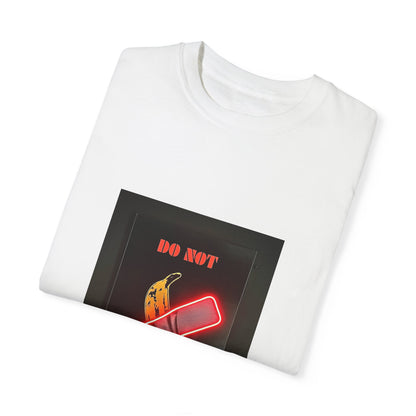 Folded Comfort Colors 1717 Unisex Garment-Dyed T-Shirt in elegant white, displaying its unique graphic of a banana with a 'DO NOT EAT' print, an ideal piece for contemporary styling.