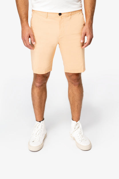 Elegant straight-fit chino shorts in soft peach-skin finish, made from sustainable organic cotton, offering both style and comfort for discerning gentlemen.