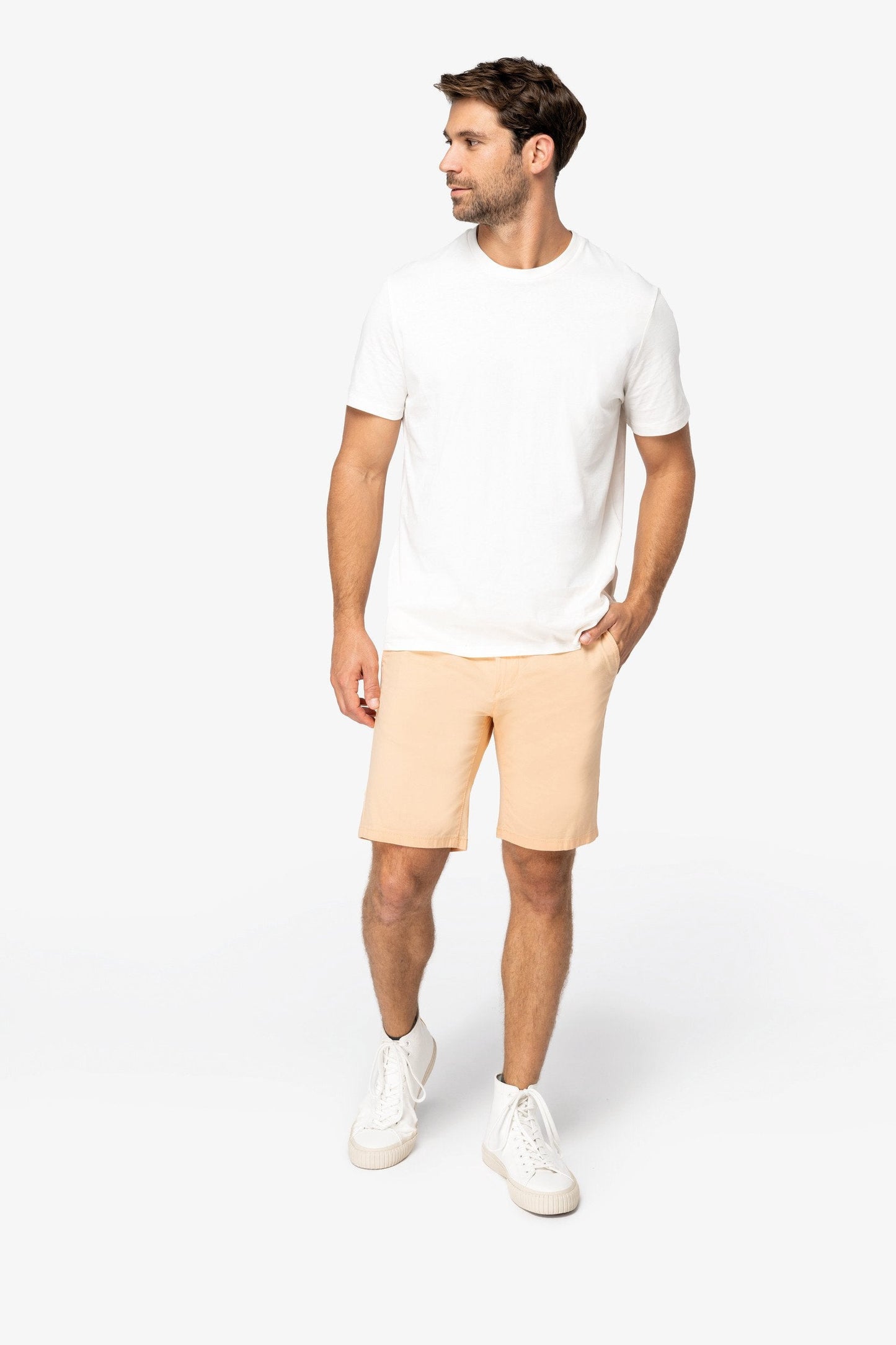 Men's organic cotton chino shorts with zip fly, expertly crafted for a lightweight feel and structured fit, ideal for a luxurious summer outfit.