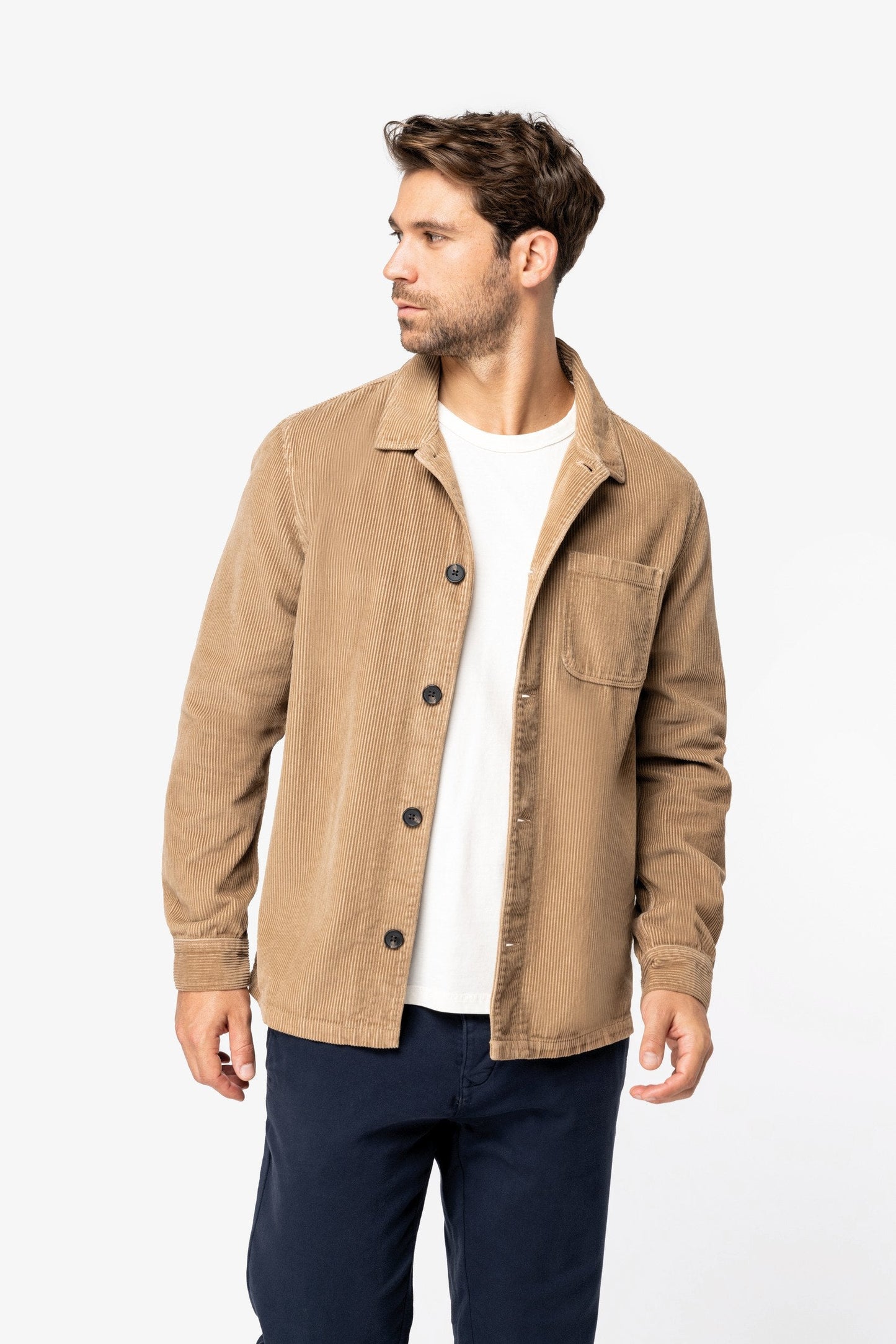 Luxurious unisex organic cotton corduroy jacket in rich texture, showcasing a stylish patch pocket and recycled buttons for an eco-friendly wardrobe.