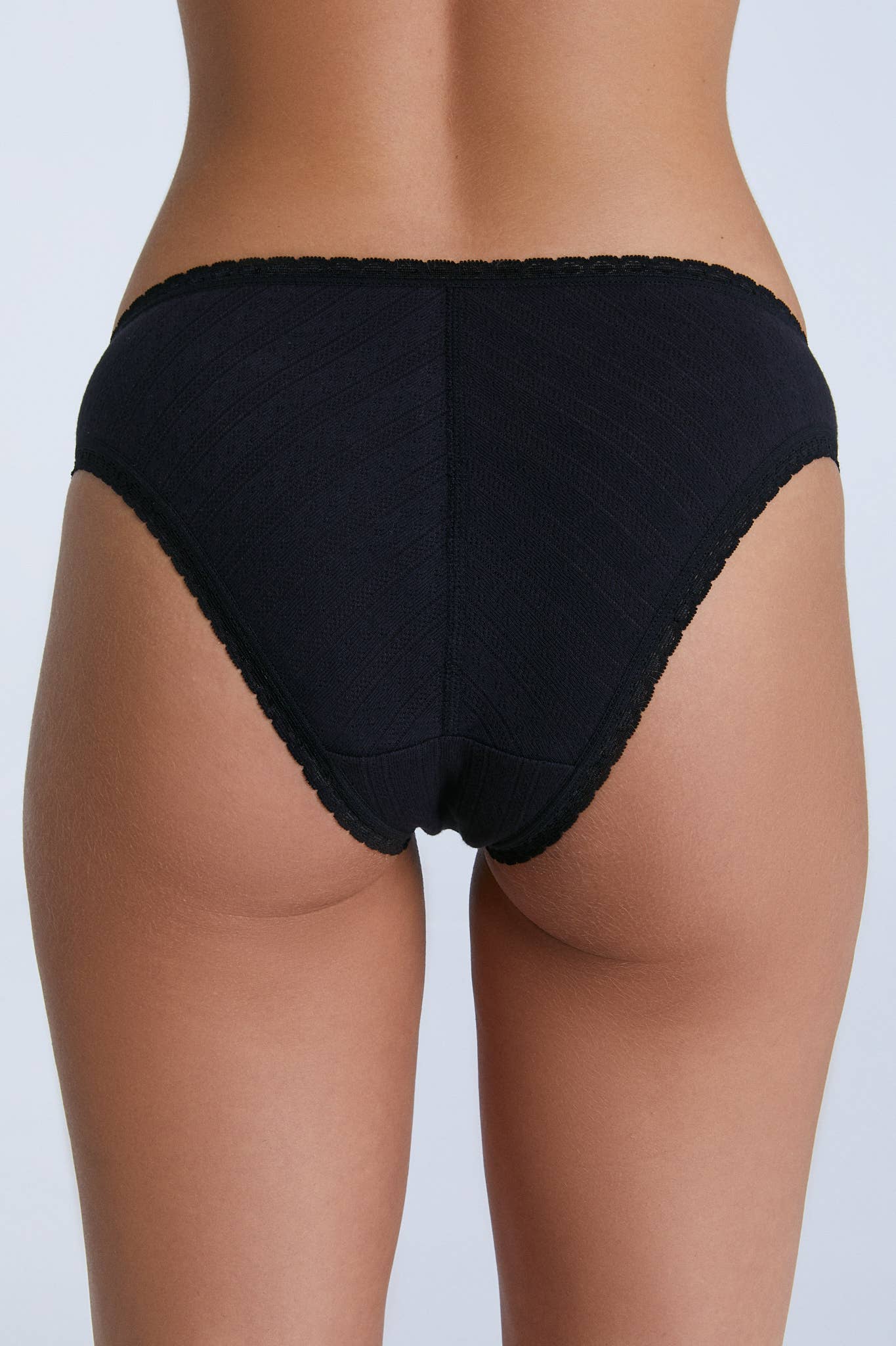 Chic view of the Organic Cotton Slip Dress with Jacquard Lace Trim, highlighting the exquisite craftsmanship and classic silhouette, ideal for sophisticated womenswear.