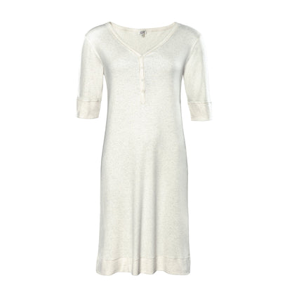 Close-up of luxurious fine ribbed fabric on women's organic cotton night shirt, showcasing softness and warmth.