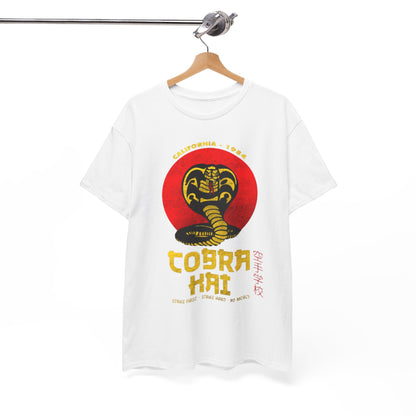 Refined white t-shirt with the prestigious Cobra Kai logo elegantly hung on display. This luxurious piece captures the essence of martial arts while offering a stylish addition to any outfit.