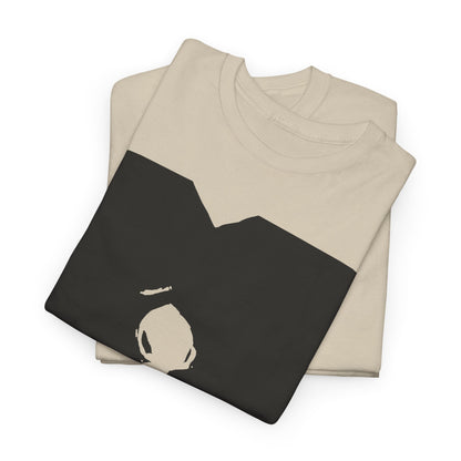 Stylish folded unisex graphic t-shirt with a striking black and white abstract design, perfect for expressing individuality and artistic flair.