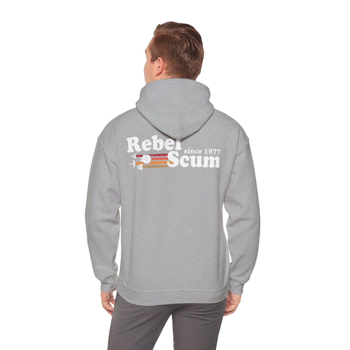 Stylish man wearing a grey hoodie displaying the 'Rebel Scum since 1977' design on the back, exuding confidence and fashion forwardness.