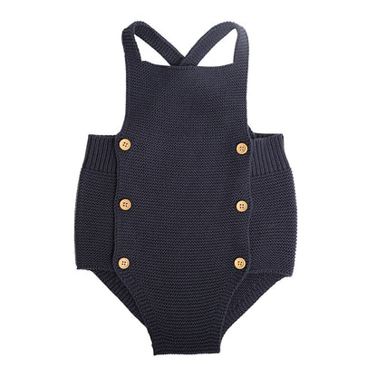 Stylish Baby Girl Cotton Romper in classic navy blue, designed with chic cross-back straps and refined button details, ideal for luxurious all-season wear.