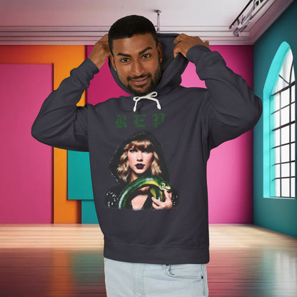 Luxurious unisex cotton hoodie for Swifties featuring a unique design with an illustration of a famous pop icon holding a green snake, in a deep navy colour.