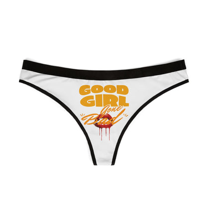 Elegant women's thong lingerie in white, adorned with striking 'Good Girl Gone Bad' lettering and glamorous lip graphic, designed for a sultry and stylish aesthetic.