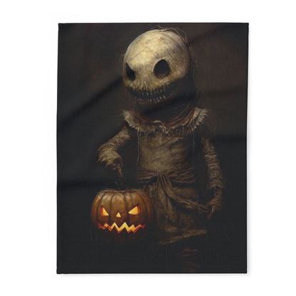 Elegant Decorative and Warm Halloween Spooky Arctic Fleece Blanket featuring a haunting figure with a pumpkin, ideal for seasonal decor.