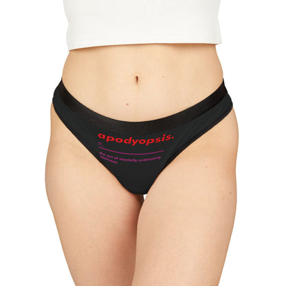 Elegant women's thong showcasing the definition of 'apodyopsis', featuring a sleek black design with bold red and pink typography, perfect for playful intimacy.