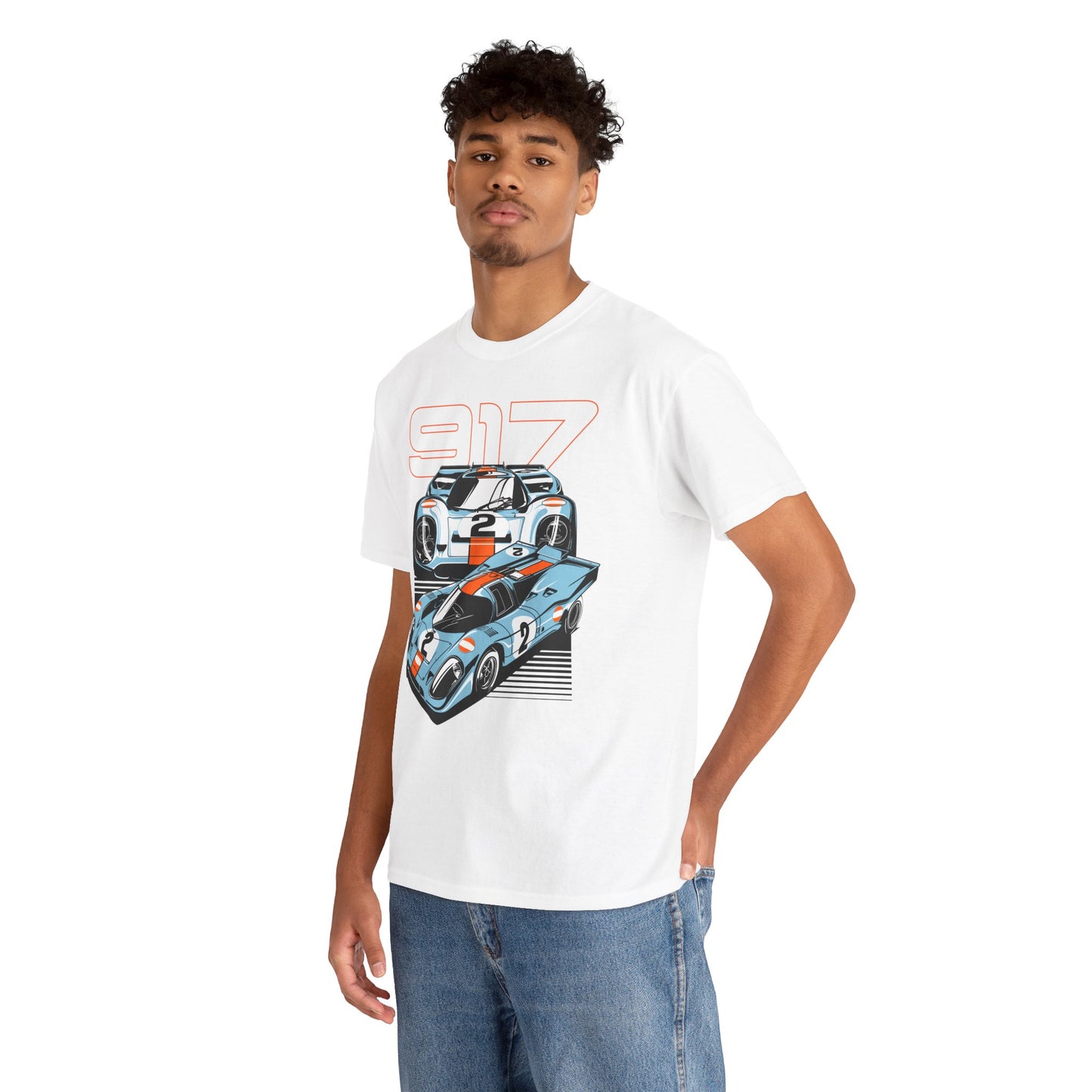 Model showcasing a Porsche 917 graphic t-shirt, featuring stunning car illustrations and a '917' design in orange and blue, paired with stylish denim. A statement piece for casual elegance.