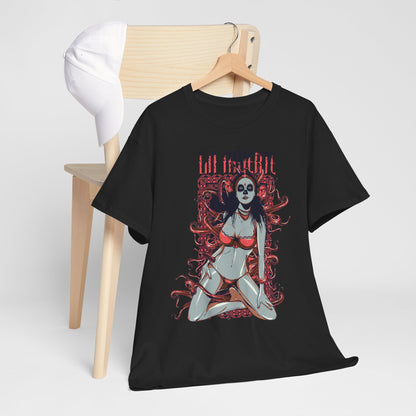 Vibrant La Muerte graphic t-shirt showcasing a striking sugar skull design, elegantly displayed on a minimalist wooden hanger with a white cap, capturing contemporary artistry.