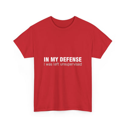 Front view of a striking red Graphic T-Shirt displaying 'In My Defence I Was Left Unsupervised', blending comfort and artistic expression.