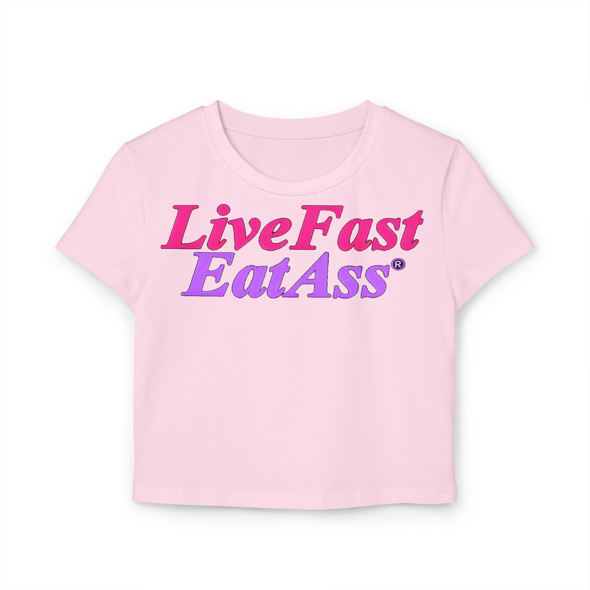 Stylish cropped t-shirt in soft pink showcasing the bold message 'Live Fast Eat Ass' in a striking gradient of pink and purple, perfect for a trendy wardrobe.