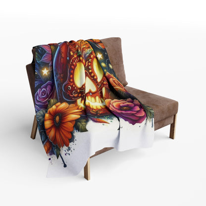 Elegant Decorative and Warm Halloween Skellington Spooky Arctic Fleece Blanket draped over a stylish armchair, featuring a detailed skull pumpkin illustration adorned with florals.