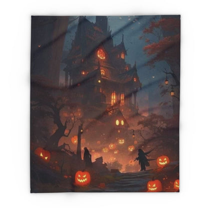 An elegant Arctic fleece blanket showcasing a spooky Halloween design of a haunted mansion and jack-o'-lanterns, ideal for cozying up this Halloween.