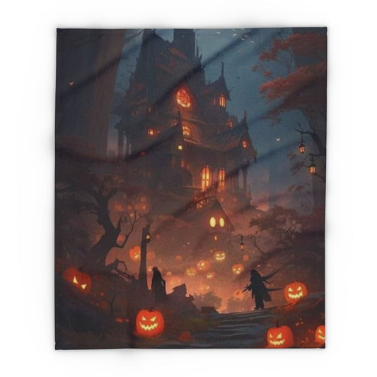 An elegant Arctic fleece blanket showcasing a spooky Halloween design of a haunted mansion and jack-o'-lanterns, ideal for cozying up this Halloween.