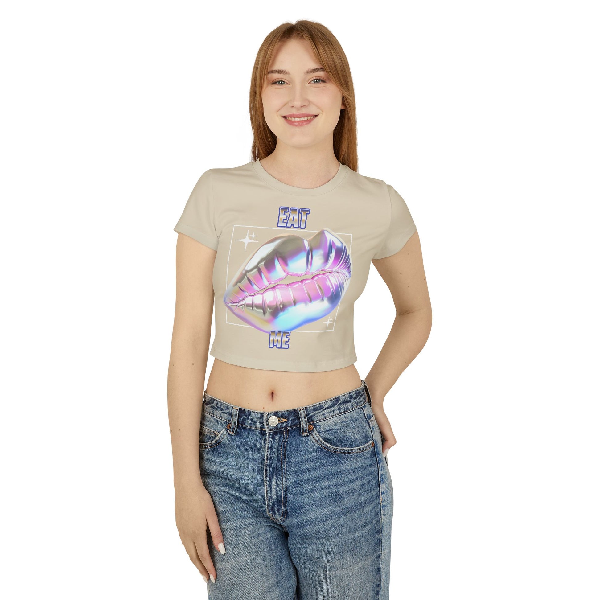 Model wearing the elegant cropped T-shirt featuring a bold 'Eat Me' graphic with iridescent lips design, styled with high-waisted jeans.