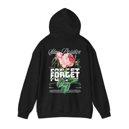 Elegant black hoodie adorned with an inspirational floral backdrop, prominently displaying the uplifting messages 'Stay Positive' and 'Forget Your Problems'.