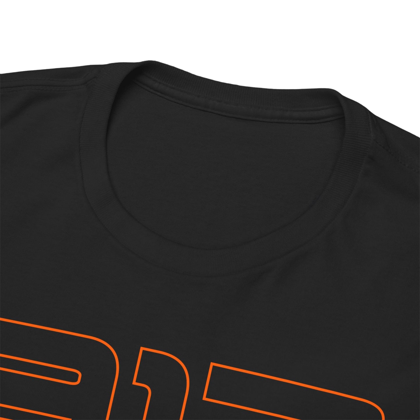 Close-up of a high-quality black t-shirt's neckline, showcasing luxurious fabric and meticulous stitching, emphasizing comfort and style for racing enthusiasts.