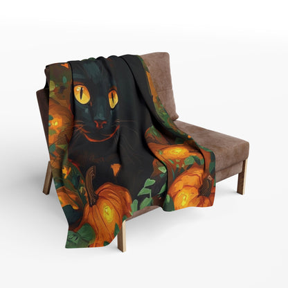 Chic Decorative and Warm Halloween Spooky Arctic Fleece Blanket draped elegantly over a chair, adorned with a delightful black cat and pumpkins, enhancing your Halloween ambiance.