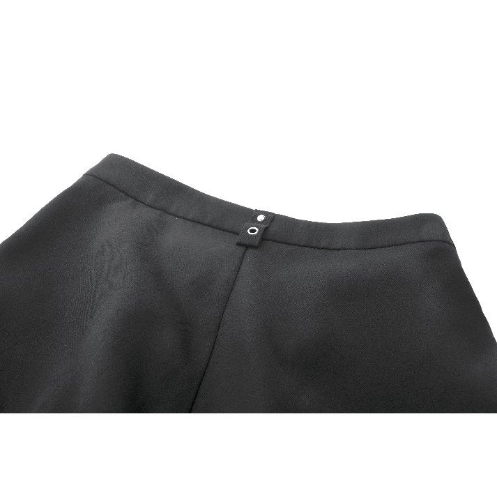 Model wearing Dark In Love High-Waisted Convertible trousers styled with chunky boots for a bold gothic look, displaying the high-rise fit.