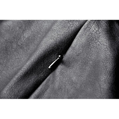 Side view of the chic faux leather mini skirt, highlighting the diagonal front flap and punk-inspired design elements.