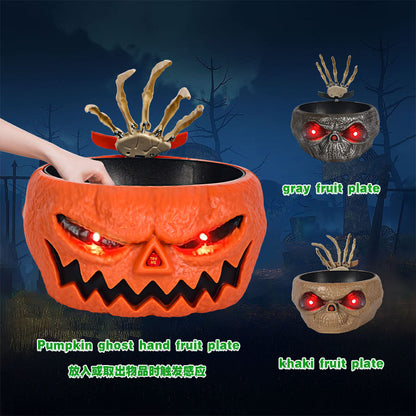 Halloween Candy Bowl With Motion Activated Skeleton Hand showcasing a pumpkin-themed bowl with eerie glowing eyes, ideal for Halloween parties.