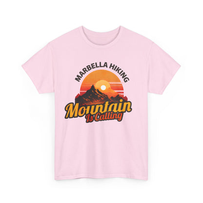 Marbella Hiking Club Unisex Graphic T-Shirt in soft pink with a premium cotton finish, featuring a unique mountain design and the phrase 'Mountain Is Calling', perfect for adventurous outdoor enthusiasts.