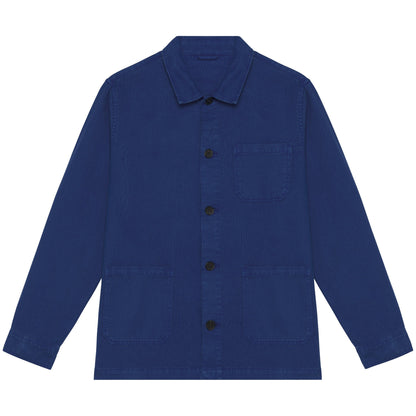 Elegant model wearing a luxury organic cotton and linen jacket in faded wash, demonstrating its regular fit and eco-friendly design elements.