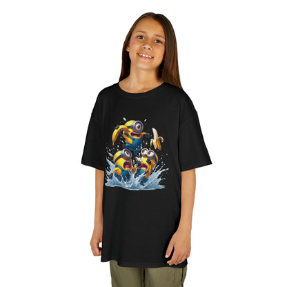 A child wearing a Minions T-Shirt Kids Despicable Me Banana Yellow Graphic Tee. The shirt features a vibrant design of three Minions splashing in water, perfect for fans who appreciate funny and playful apparel. T Shirt, Funny, Minions.