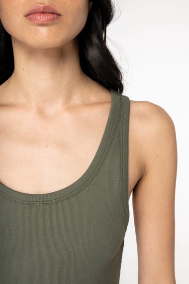 Women's organic cotton tank top in versatile black, perfect for layering under jackets or styled alone for sophisticated looks.
