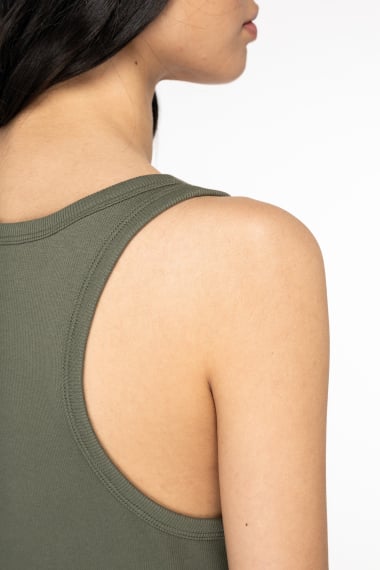 Elegant women's tank top featuring modest hem length, designed for both tucking and untucked styles in chic everyday wardrobes.