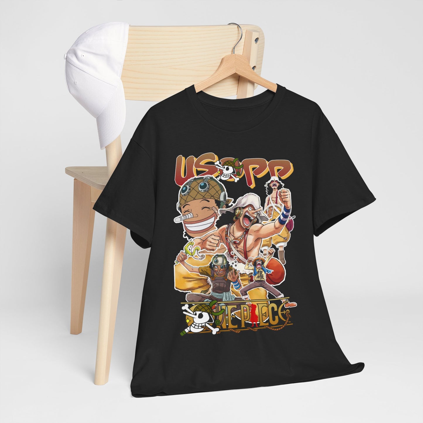 Sophisticated setting with an Anime Manga T-shirt prominently featuring Usopp, accompanied by a white cap, embodying style and passion for anime.